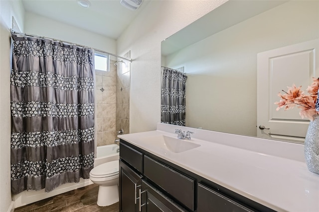 full bathroom with hardwood / wood-style flooring, vanity, toilet, and shower / tub combo