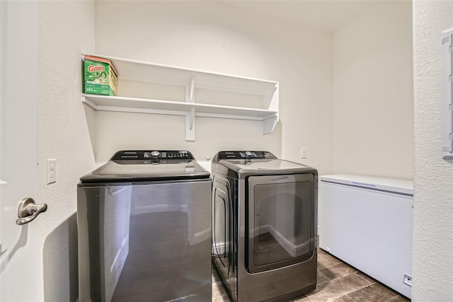 clothes washing area featuring washing machine and clothes dryer