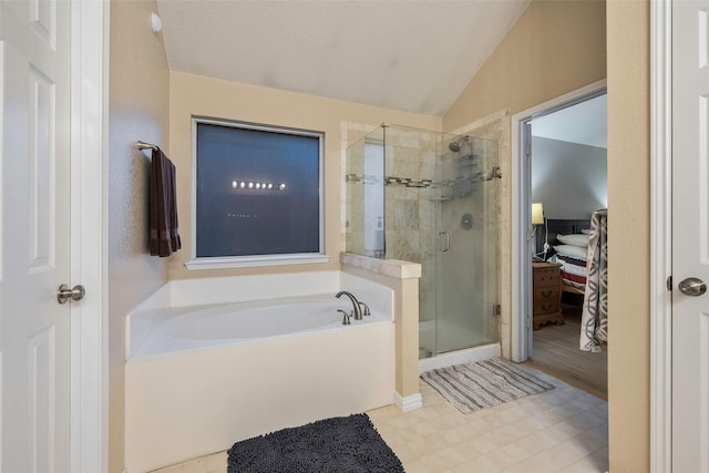 bathroom featuring vaulted ceiling, independent shower and bath, and a textured ceiling