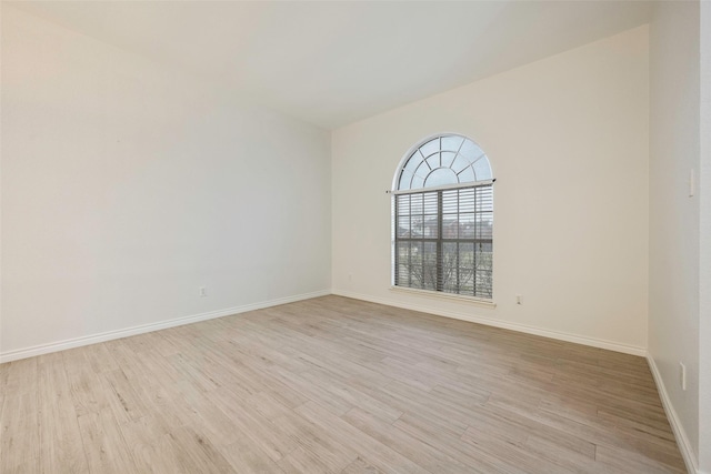 unfurnished room with light hardwood / wood-style flooring