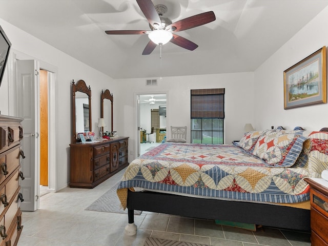 tiled bedroom with ceiling fan