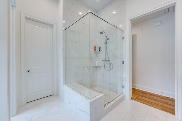 bathroom featuring an enclosed shower