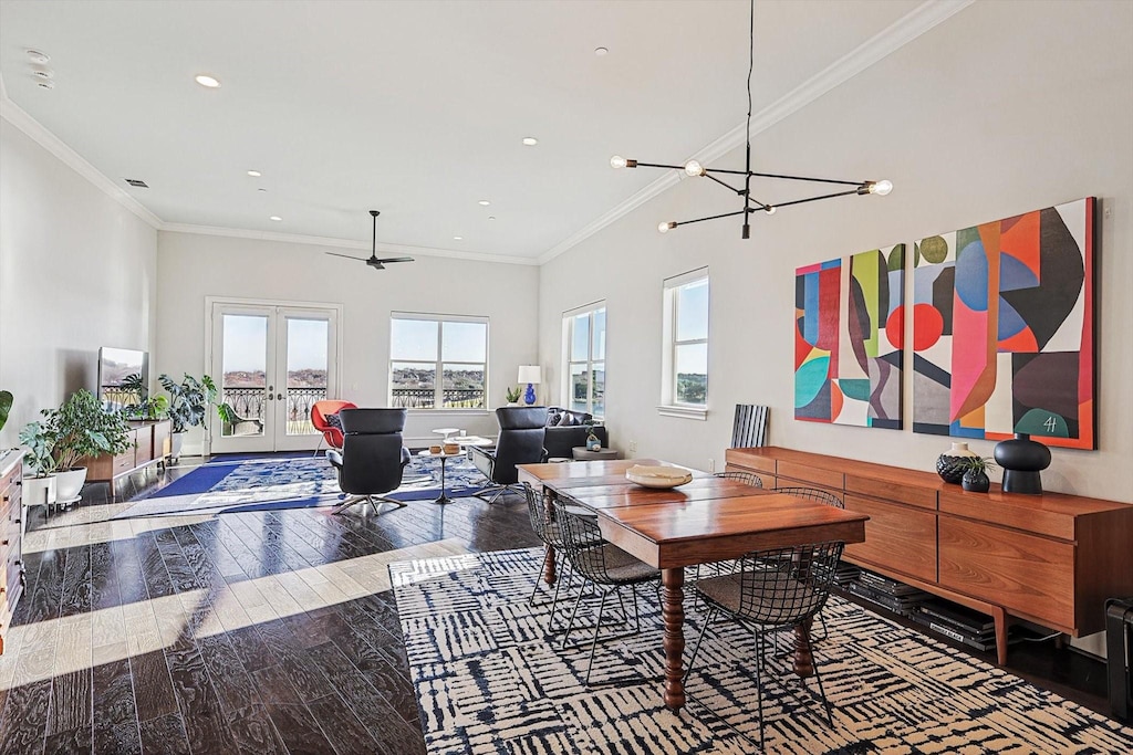 office space with ceiling fan with notable chandelier, wood-type flooring, ornamental molding, and french doors