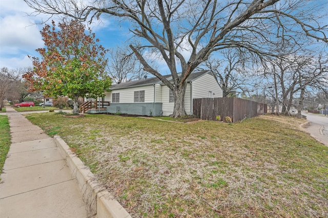 view of property exterior with a yard