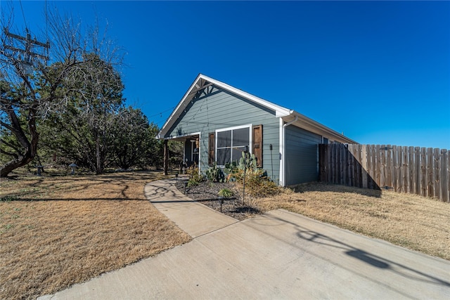 view of side of home featuring a yard