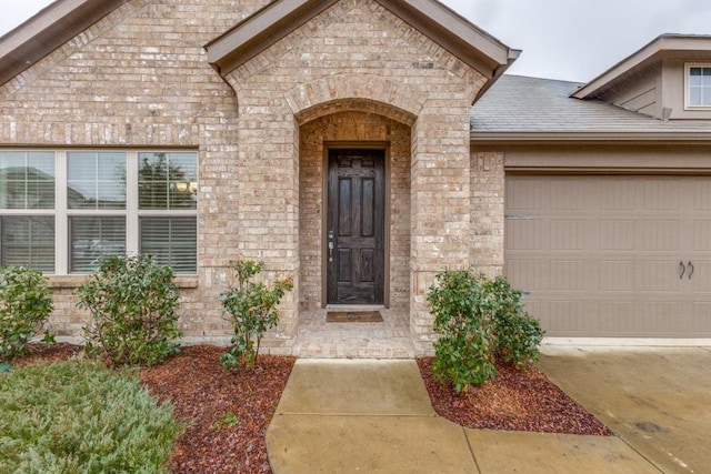 property entrance with a garage