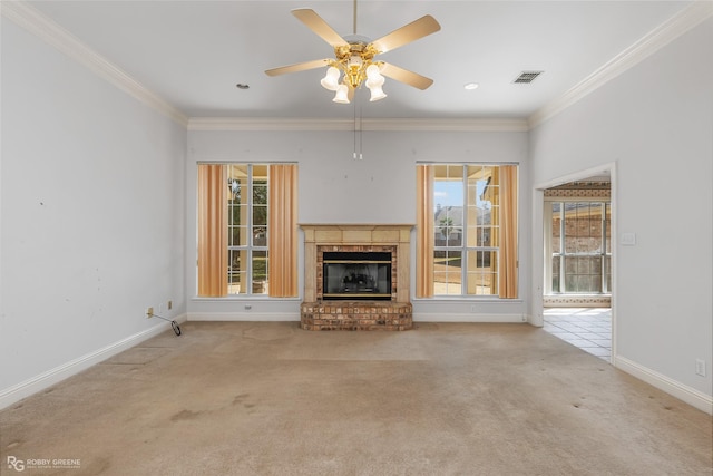 unfurnished living room with light carpet, a fireplace, ornamental molding, and ceiling fan