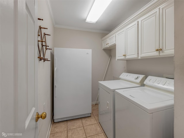 washroom with independent washer and dryer, cabinets, crown molding, and light tile patterned floors