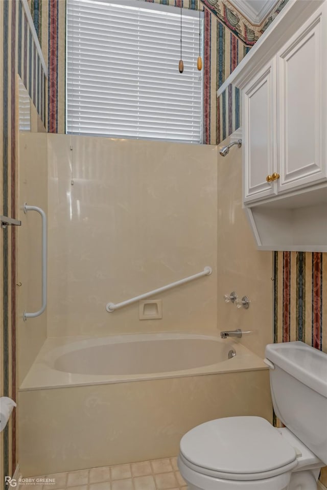 bathroom with shower / bathtub combination and toilet