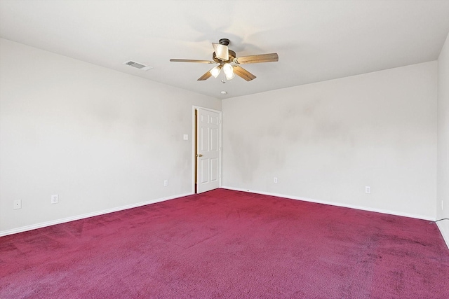 spare room featuring ceiling fan and carpet flooring