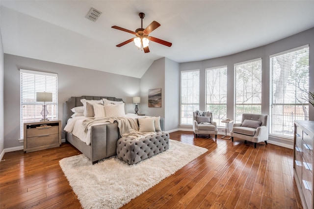 bedroom featuring vaulted ceiling, dark hardwood / wood-style floors, and ceiling fan