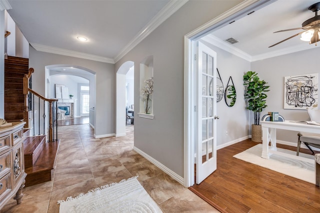 interior space with crown molding and light hardwood / wood-style floors