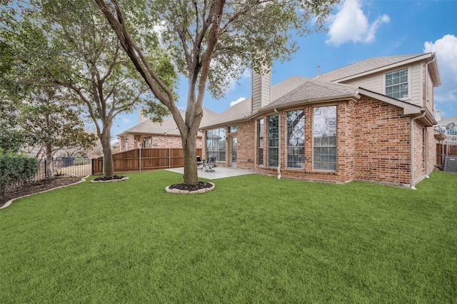 view of yard featuring a patio and central AC