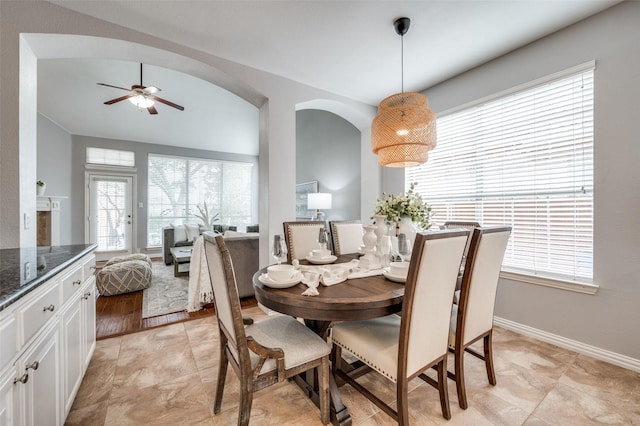 dining space with plenty of natural light and ceiling fan