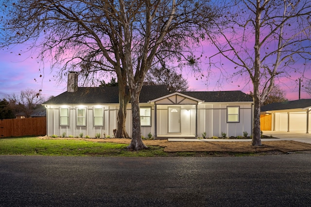 view of front of house with a yard