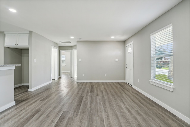 unfurnished living room with light wood-type flooring