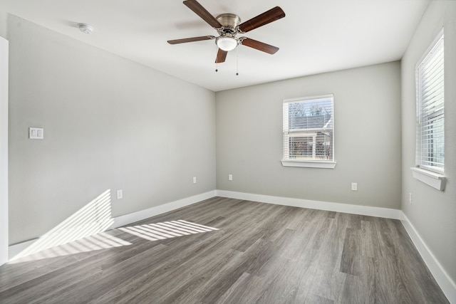 unfurnished room featuring ceiling fan and hardwood / wood-style floors