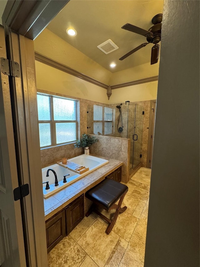 bathroom with independent shower and bath and ceiling fan