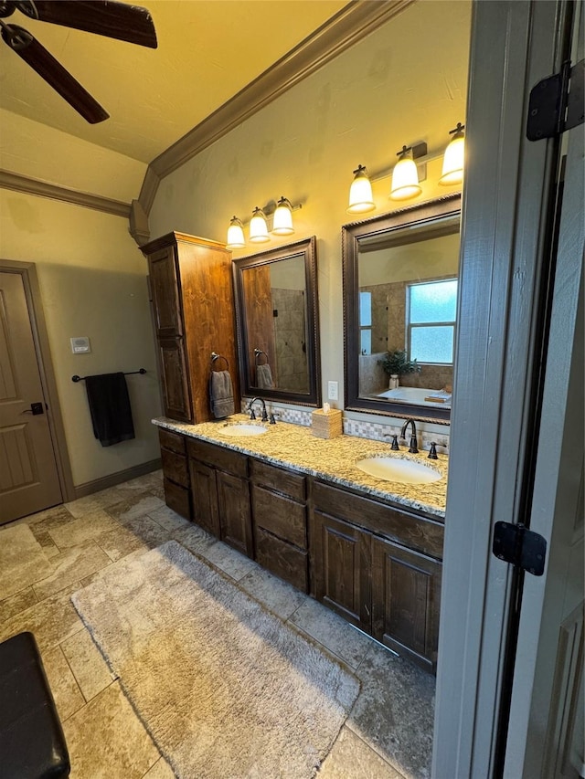 bathroom featuring vanity, crown molding, and ceiling fan