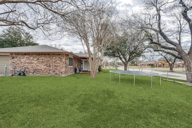 view of yard featuring a trampoline