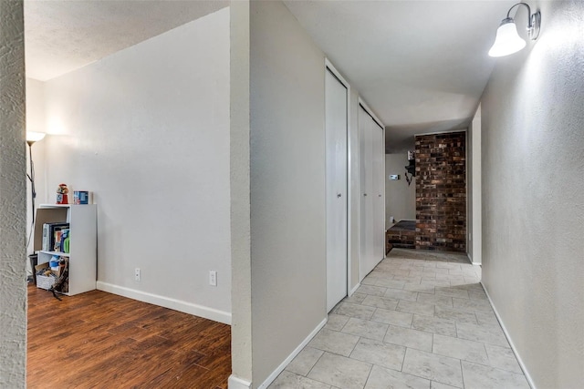 hall with light wood-type flooring