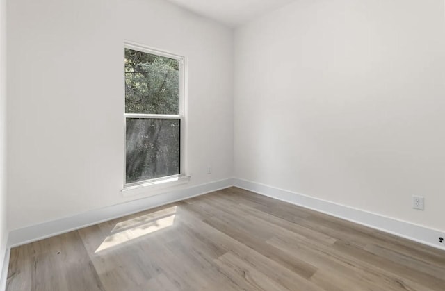 unfurnished room featuring light hardwood / wood-style floors