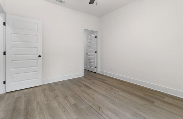 empty room featuring light hardwood / wood-style floors and ceiling fan