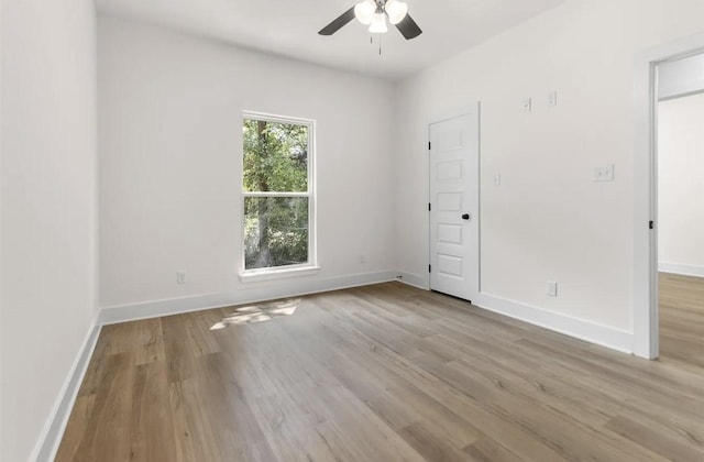 unfurnished room with ceiling fan and light hardwood / wood-style flooring