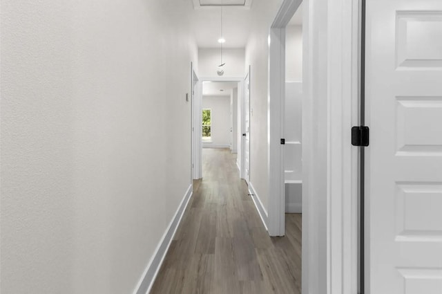 corridor featuring hardwood / wood-style floors