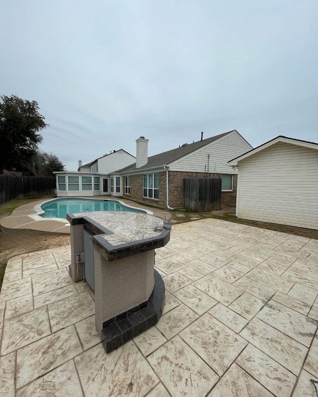 view of pool featuring a patio