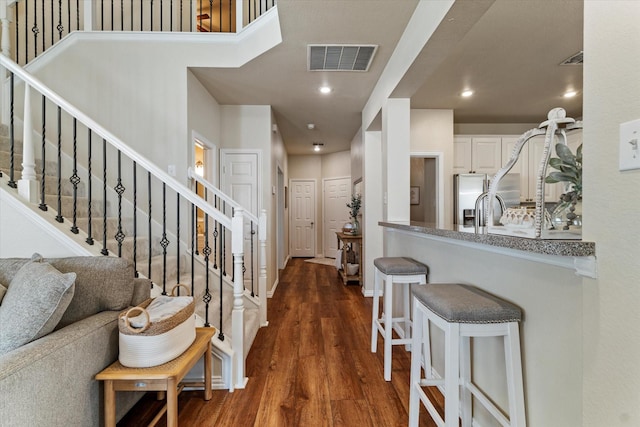 entrance foyer featuring dark hardwood / wood-style flooring