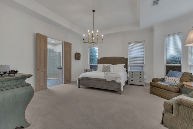 bedroom featuring a raised ceiling, carpet floors, and multiple windows