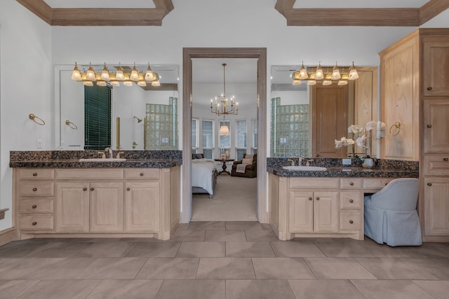 bathroom with vanity, tile patterned flooring, and a chandelier