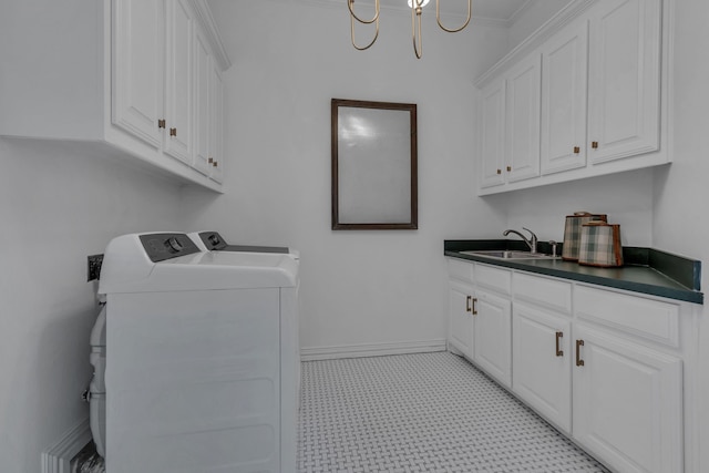 washroom with sink, cabinets, and independent washer and dryer