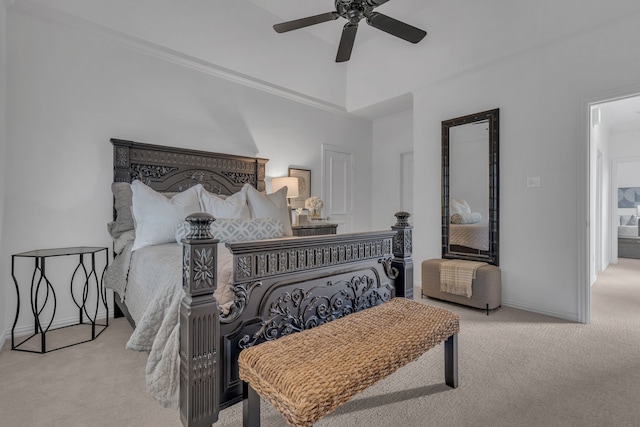 bedroom with ceiling fan and light carpet