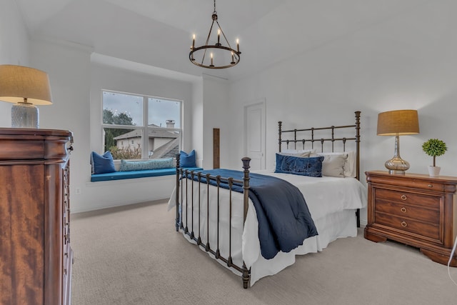 bedroom featuring an inviting chandelier and light colored carpet