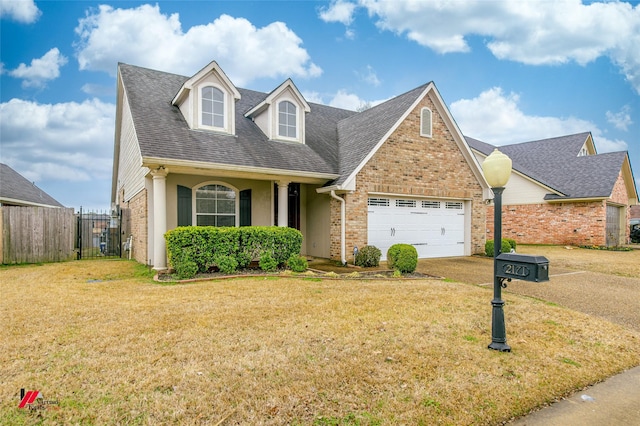 view of front facade with a garage and a front yard