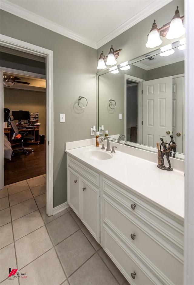 bathroom featuring tile patterned flooring, vanity, crown molding, and ceiling fan