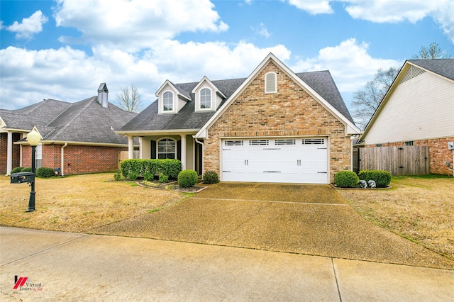 view of front facade with a garage and a front lawn