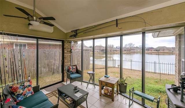 sunroom featuring a water view, ceiling fan, a wall mounted AC, and vaulted ceiling