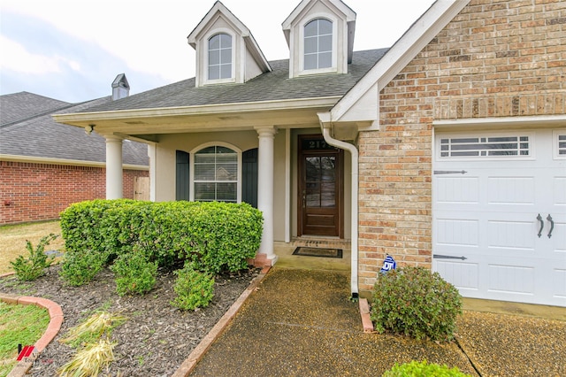 entrance to property with a porch and a garage