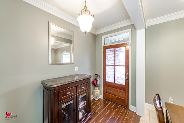 entryway featuring ornamental molding