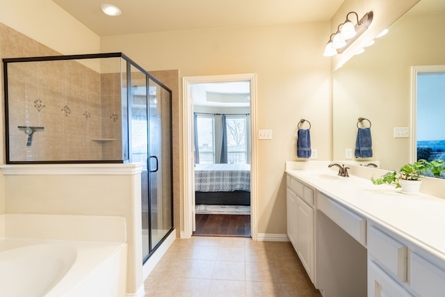 bathroom featuring vanity, tile patterned floors, and shower with separate bathtub