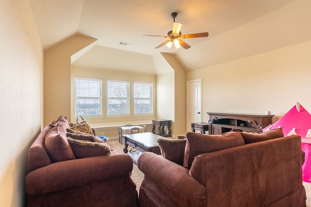 living room featuring lofted ceiling, carpet floors, and ceiling fan