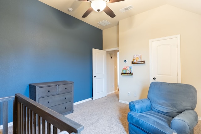 sitting room with light carpet, vaulted ceiling, and ceiling fan