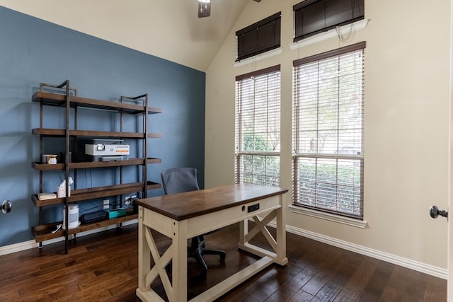 home office with vaulted ceiling and dark hardwood / wood-style flooring