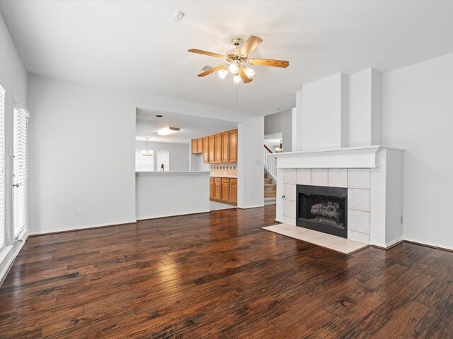 kitchen featuring light tile patterned floors, range with electric cooktop, a center island, and ceiling fan