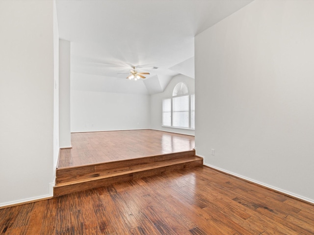 unfurnished room with vaulted ceiling, ceiling fan, and hardwood / wood-style floors