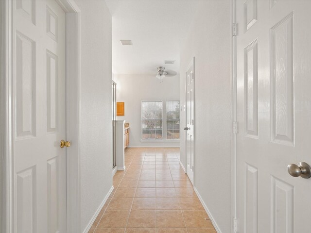 hallway with light tile patterned flooring