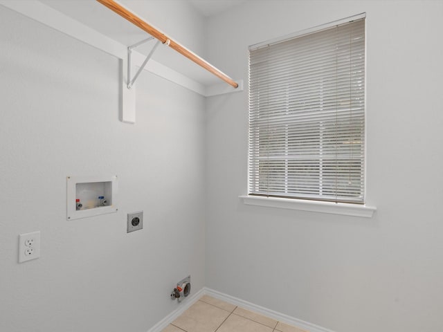 clothes washing area featuring washer hookup, hookup for an electric dryer, and light tile patterned floors